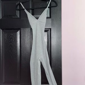 Tight gray jumpsuit with cross back